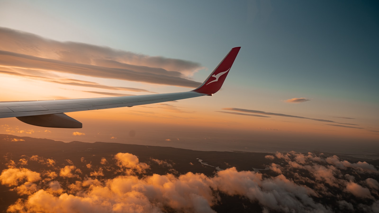a large jetliner flying through a blue sky