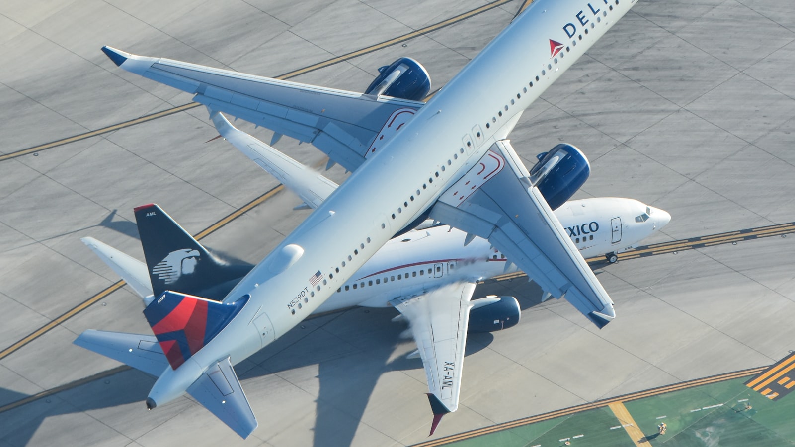 A large jetliner sitting on top of an airport tarmac