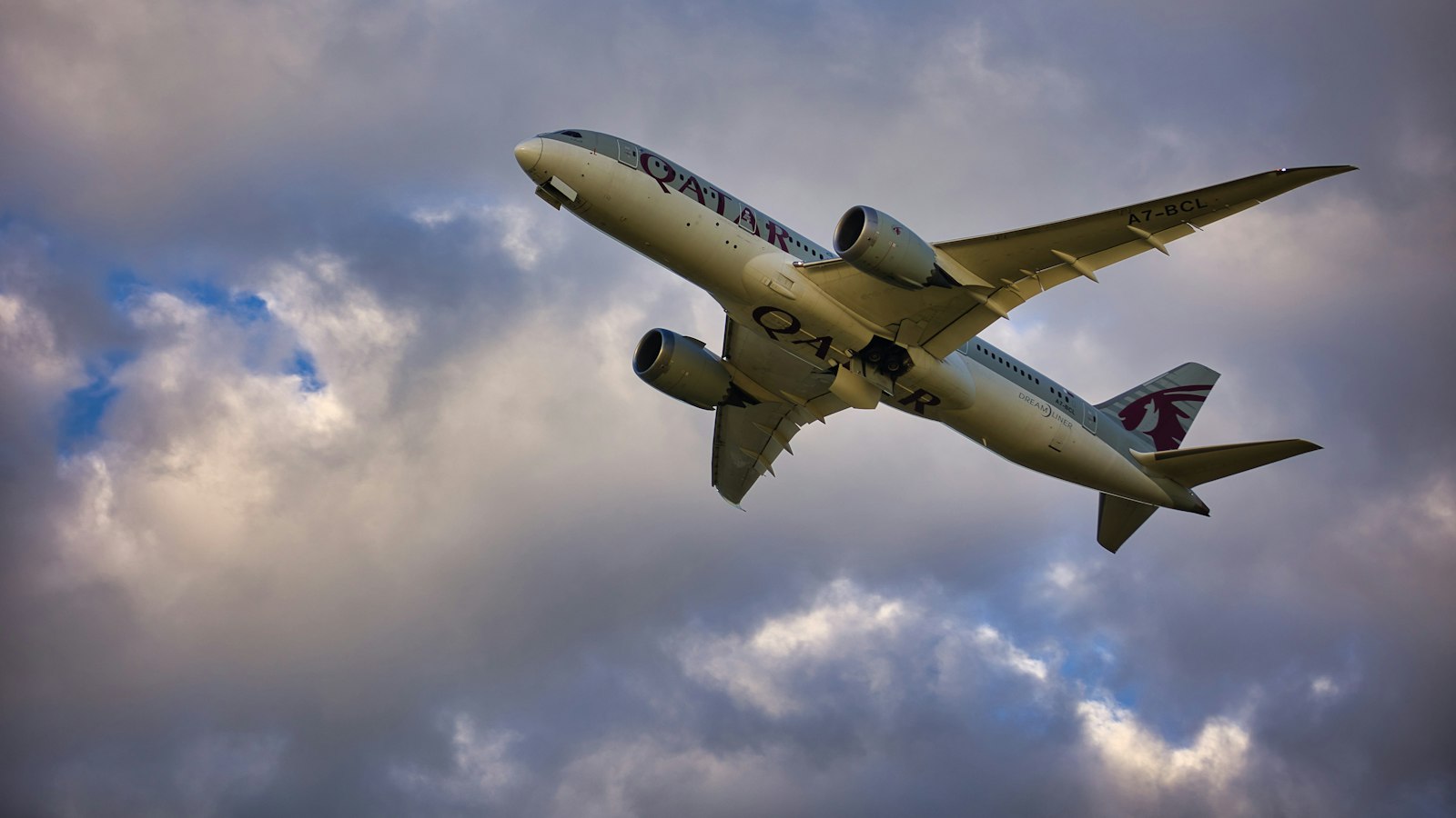 A large passenger jet flying over a city