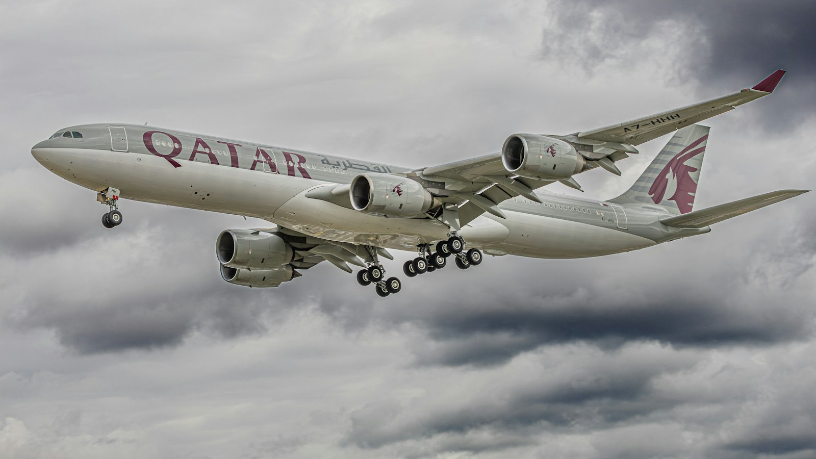 a large jetliner flying through a blue sky
