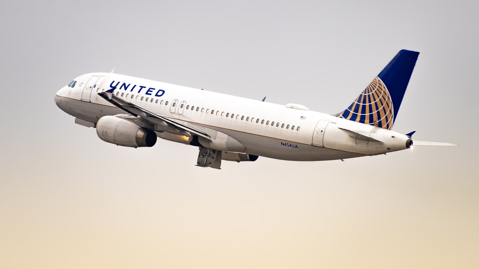 a united airlines plane flying in the sky