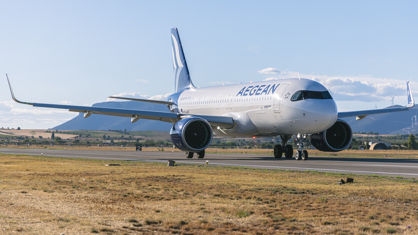 A large jetliner sitting on top of an airport runway
