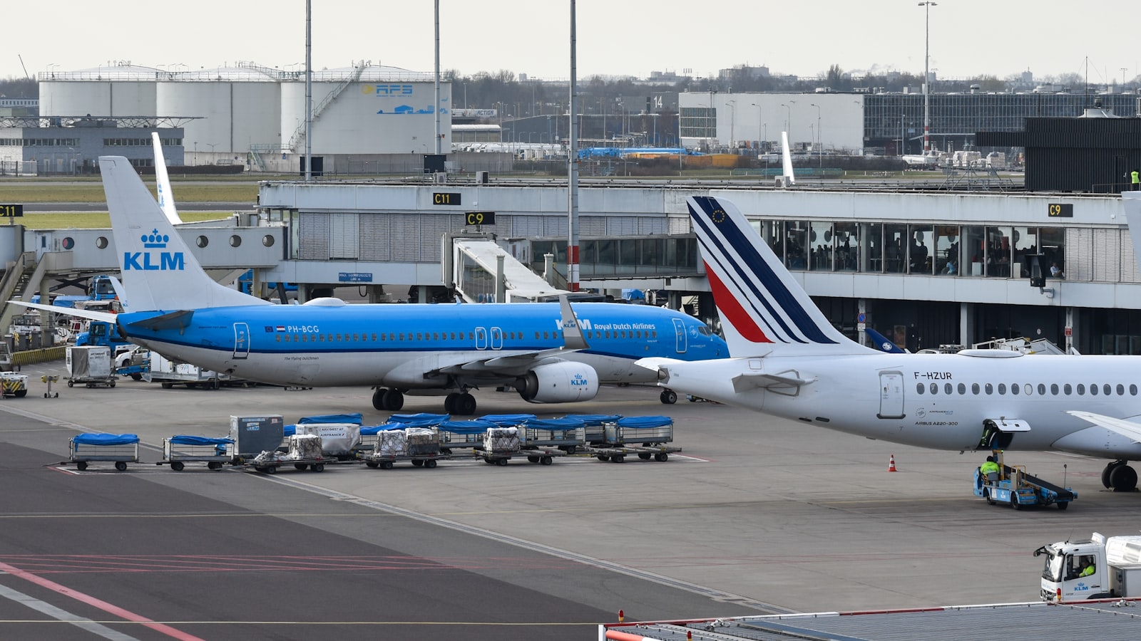 Airplanes are parked at an airport terminal