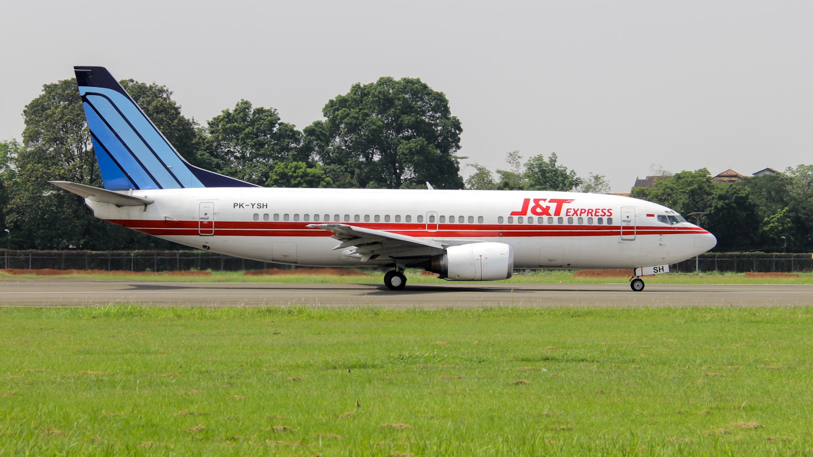 a large jetliner sitting on top of an airport runway