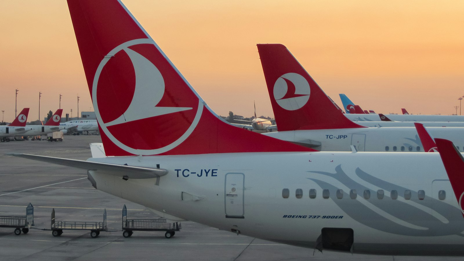 a couple of airplanes at an airport