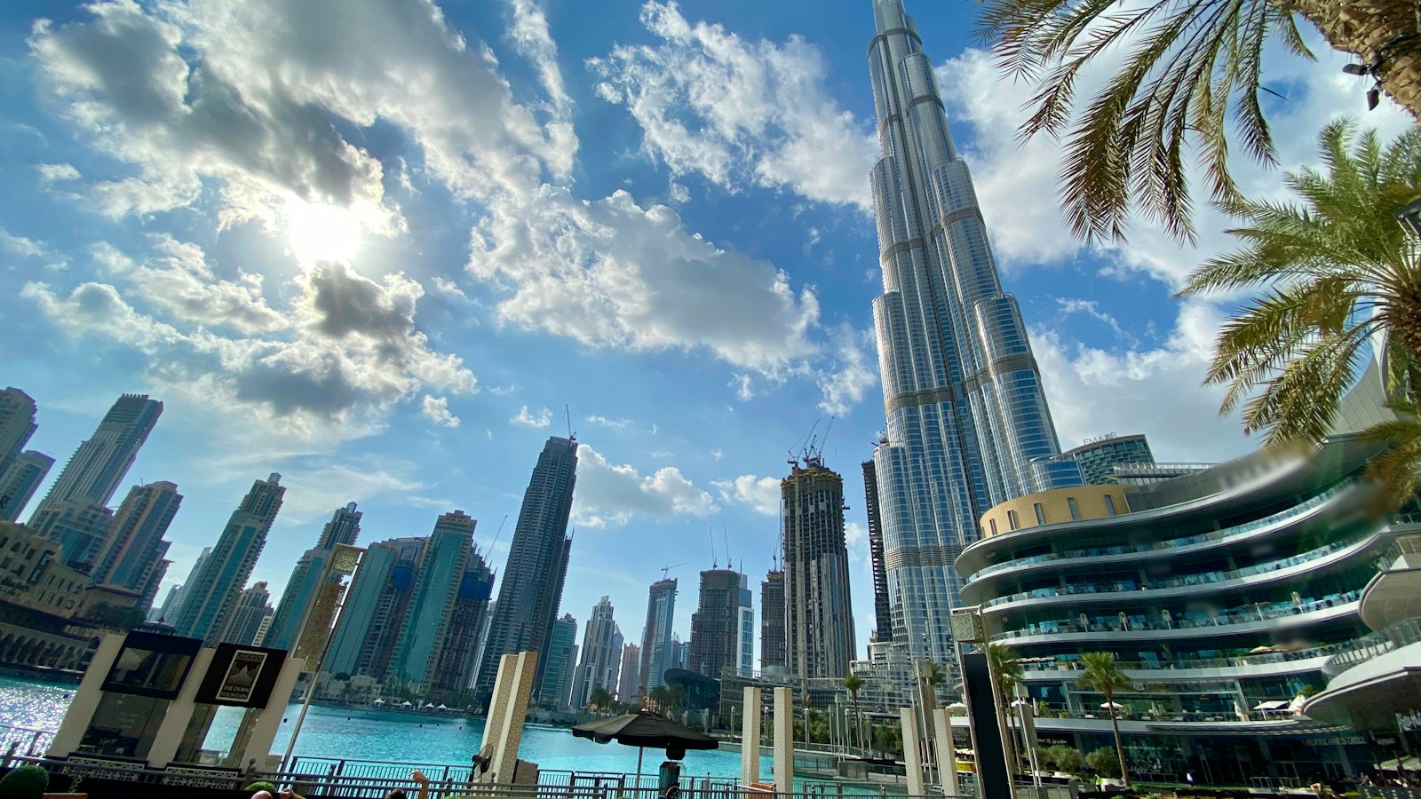 white and gray high rise buildings near body of water during daytime
